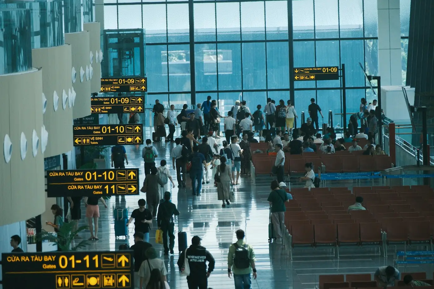 Passengers walking through an airport terminal