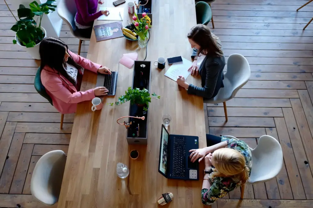 Coworking space with tenants working at a shared table