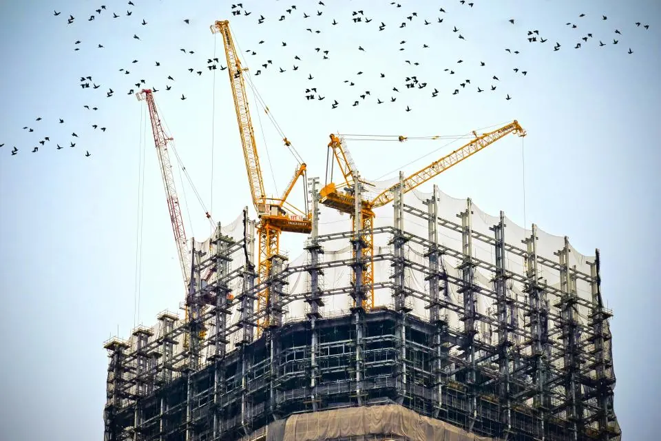 Tower cranes over a building under construction