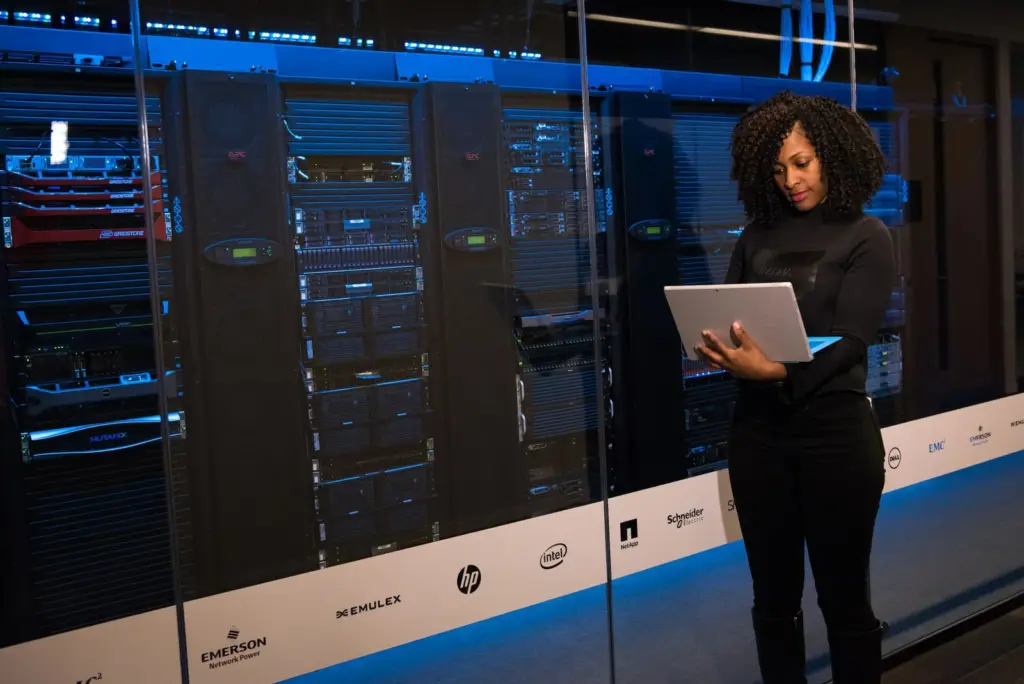 Network engineer checking equipment in a server room