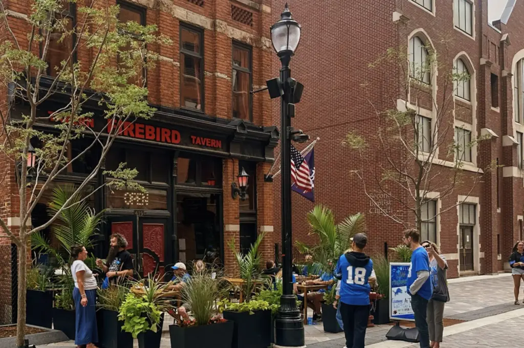 Firebird Tavern patio in Greektown with visitors on public Wi-Fi