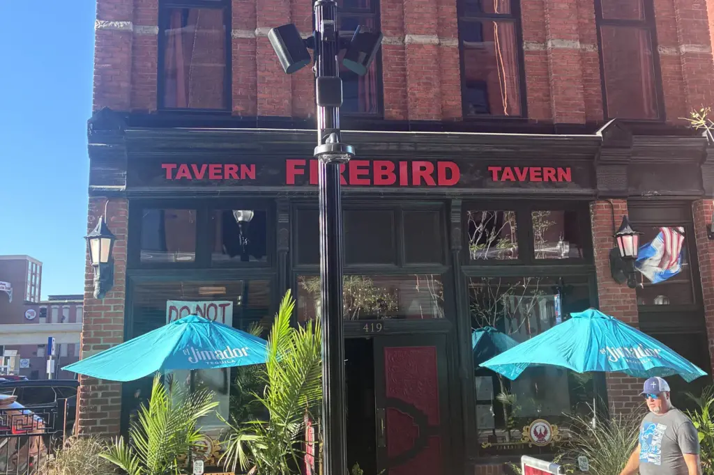 Firebird Tavern patio in Greektown with visitors on public Wi-Fi