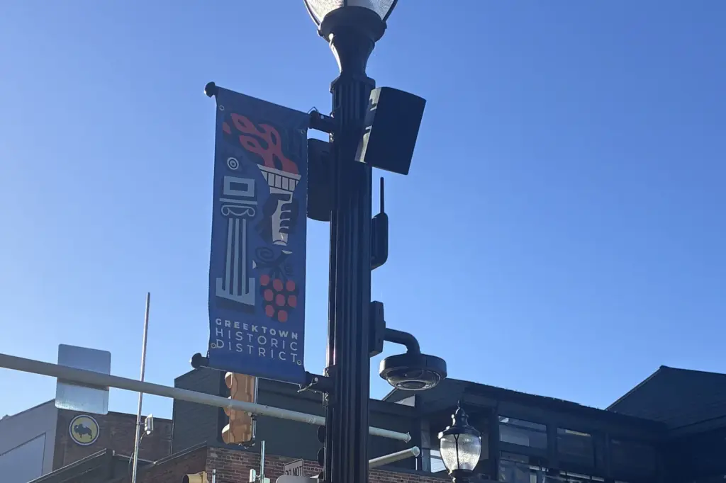 Greektown smart pole with district banner, camera and speakers