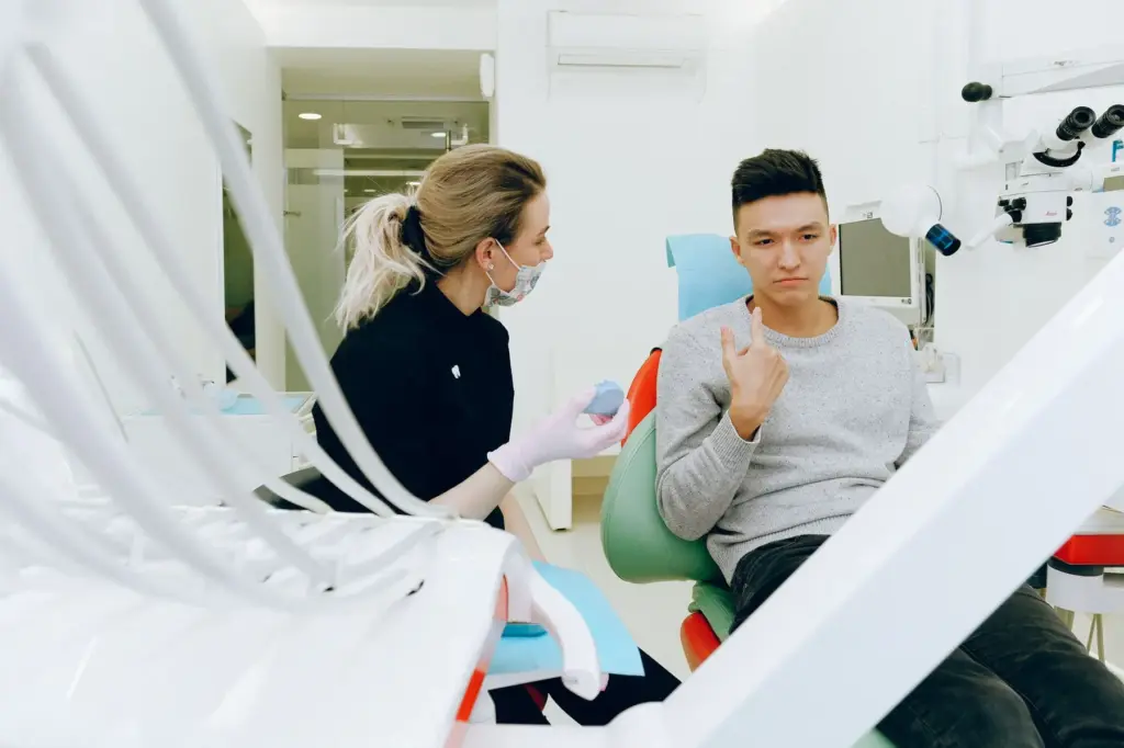 Dentist talking with a patient in a dental office