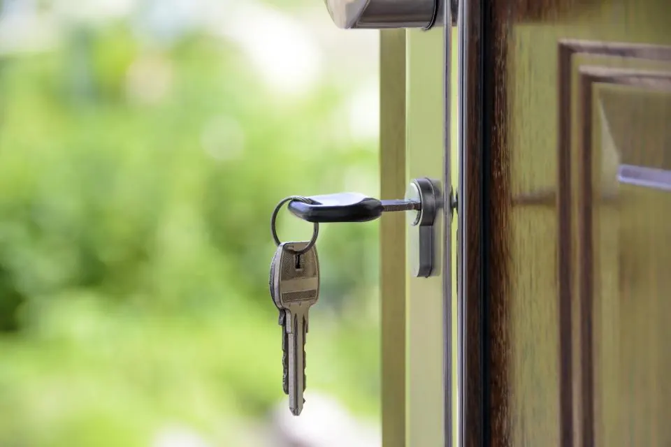 Keys in the front door of a home