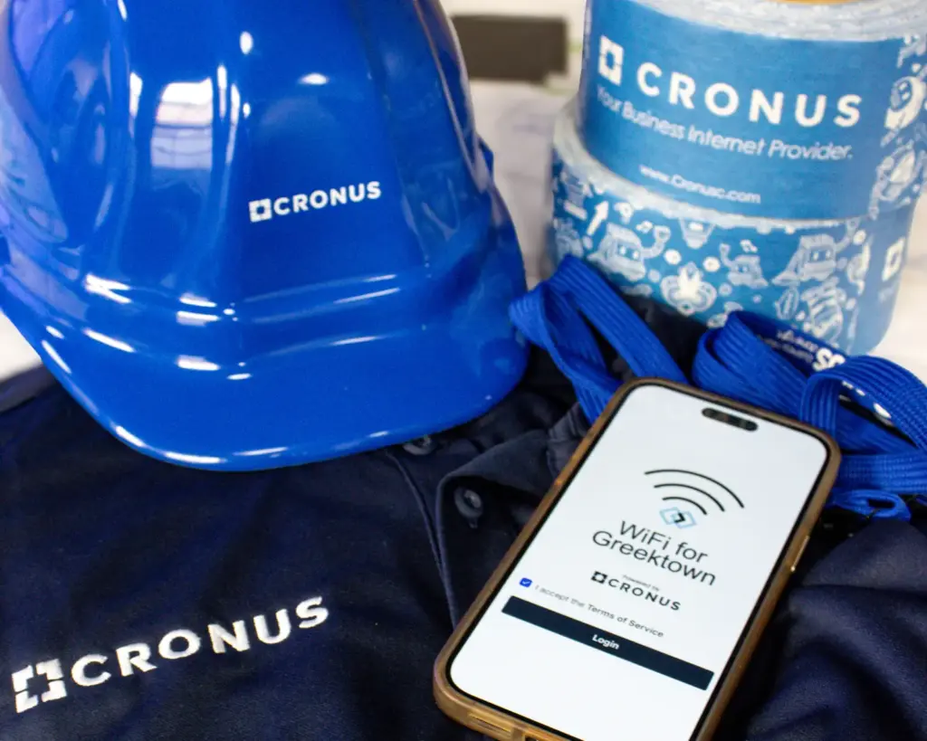 Cronus hard hat, team shirt and Wi-Fi login on a phone