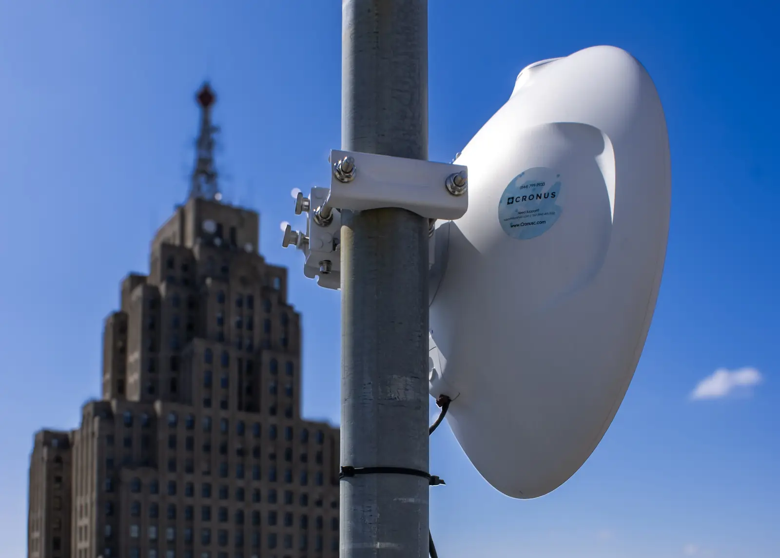 Cronus wireless radio beside a downtown Detroit skyscraper